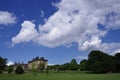 Bretton Hall under a blue sky with white clouds, grass and trees. West Bretton, Wakefield, UK. June 4, 2012.