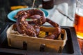 Bretzel in a basket and beer. German cuisine