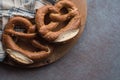 Bretzel with salt on wooden background