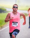 BREVARD, NC-MAY 28, 2016 -Happy man runs in the White Squirrel Race with over 350 runners in Brevard, NC 2016. Race is sponsored