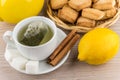 Brewed tea, sugar and cinnamon, lemon and shortbread cookies