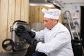 Brewer opens the hatch in the beer tank at brewery Royalty Free Stock Photo