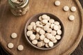 Brewer`s yeast tablets in a bowl, top view