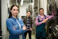 Brewers posing at brewery factory