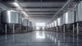 Brewery or alcohol production factory. Large steel fermentation tanks in spacious hall