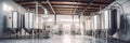 Brewery or alcohol production factory. Large steel fermentation tanks in spacious hall