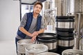 Brewery, man and portrait with container in factory with confidence, pride and container tank for manufacturing Royalty Free Stock Photo