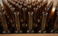 The necks of empty beer bottles, which will pour beer, top view