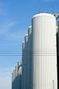 Brewery tanks blue sky big containers beer production industry Royalty Free Stock Photo