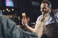 Brewery worker with glass of beer Royalty Free Stock Photo