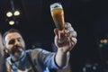 Brewery worker with glass of beer Royalty Free Stock Photo