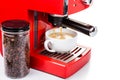 Brewing coffee with a bright red color espresso coffee machine Royalty Free Stock Photo