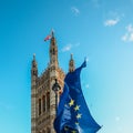 Brexit concept with European union flag juxtapositioned against Victoria tower, Westminster, London, UK Royalty Free Stock Photo