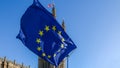 Brexit concept with European union flag juxtapositioned against Victoria tower, Westminster, London, UK