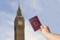 Brexit concept: a man hold italian passport in front of the Big Ben. Uk announce stop of fredoom of movement to other european Royalty Free Stock Photo