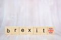 Brexit concept. Brexit word written on wood blocks with British flag. Brexit text on wooden table for your desing Royalty Free Stock Photo