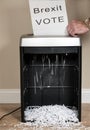 Brexit vote being shredded in an office shredder