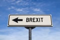 Brexit road sign with arrow, arrow on blue sky background