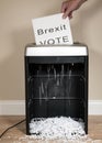 Brexit vote being shredded in an office shredder