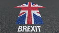 Brexit word and Great Britain flag on the road