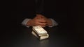 BRIBE: Businessman sits near a heap money on a table