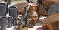 Bric-a-brac of copper and tin objects at flea market Royalty Free Stock Photo