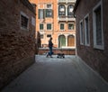 Brick alleys of the old city of Venice. The beauty of the ancient city. Italy