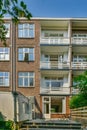 a brick apartment building with balconies and a staircase Royalty Free Stock Photo