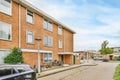 a brick apartment building with bicycles parked outside of it Royalty Free Stock Photo