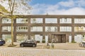 a brick apartment building with a car parked in front Royalty Free Stock Photo