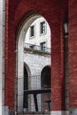 Brick arch framing stone facade building in Madrid