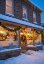 Brick bakery in a snowy setting with large decorated windows featuring snowflake patterns Royalty Free Stock Photo