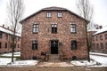 Oswiecim / Poland - 02. 15. 2018: Brick barracks, block houses of the Auschwitz Concentration Camp Museum. Royalty Free Stock Photo