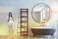 Brick bathroom interior, black tub, woman Royalty Free Stock Photo