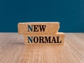 Brick blocks with new normal wording. The world is changing to balance it into new normal include business , economy , environment Royalty Free Stock Photo