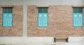 Brick building with blue wooden shuttered windows