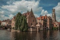 Brick buildings on the canal in a sunny day at Bruges