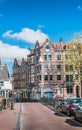 Brick buildings at the edge of canals in Amsterdam