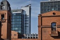 Brick buildings in an old brewery and the facade of a modern office building Royalty Free Stock Photo