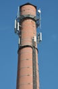 Brick chimney with antenna cellular systems Royalty Free Stock Photo