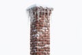 Brick Chimney With Icicles Captured in Detail Against a White Background Showcasing Winter Elements and Textures in High Royalty Free Stock Photo