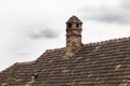 Brick chimney on the roof of old house. Royalty Free Stock Photo