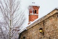 Brick chimney and smoke from it in winter. Close up Royalty Free Stock Photo