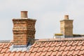 Brick chimney stack on modern contemporary house roof top Royalty Free Stock Photo