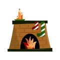 Brick Christmas fireplace with blazing fire isolated on white background.