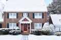 Brick Colonial House with Arched Red Door at the Holidays Royalty Free Stock Photo