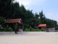 Brick-colored gazebos on the beach Royalty Free Stock Photo