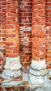 Brick columns of red brick, round in the city, abandoned building in the summer. Royalty Free Stock Photo