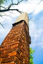 Brick and concrete obelisk or pillar against a blue sky Royalty Free Stock Photo