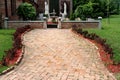 Brick covered path leading to backyard of old family brick house Royalty Free Stock Photo